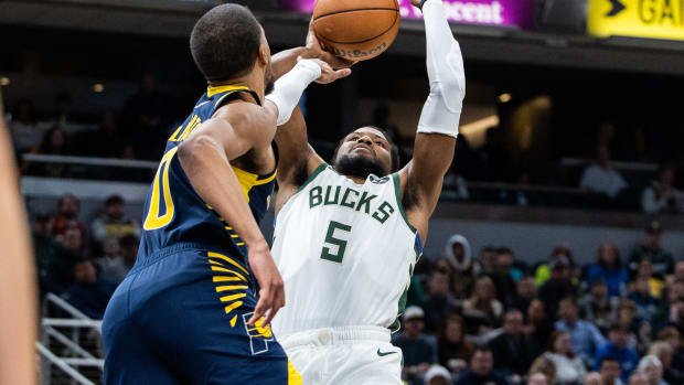 Beasley shoots over Haliburton during the Bucks' 142-130 loss to the Pacers on Jan. 3, 2024.